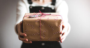 cyber week hands holding gift feature