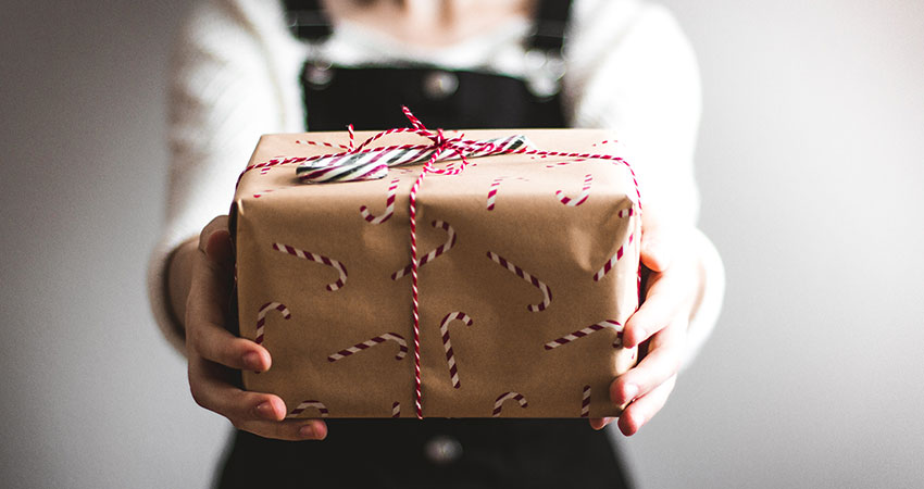 cyber week hands holding gift feature